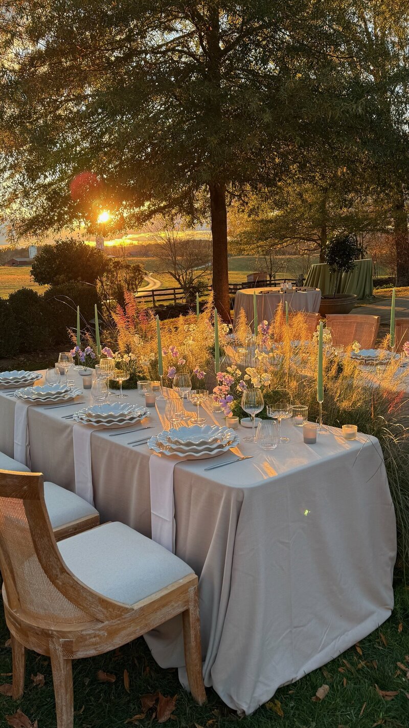 Luxury wedding reception at Poplar Springs Manor in Virginia, featuring tall floral centerpieces, lush greenery installations, and candlelit tables beneath a grand chandelier. Reception flowers by Springvale Floral, editorial wedding florist serving DC, Virginia, and Maryland.
