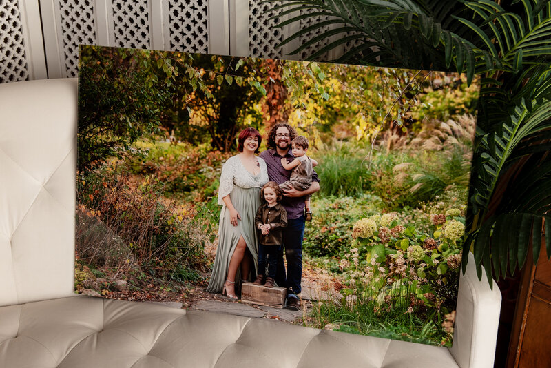 Gold frame of maternity session with mom using a white gown