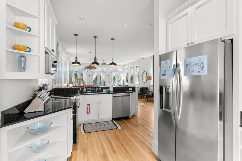 Spacious open-concept kitchen and living room at The Florida House, perfect for family vacations in Carillon Beach, near Panama City Beach and Alys Beach rentals.