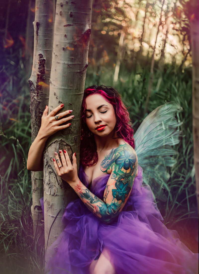 woman with fairy wings in forest photo