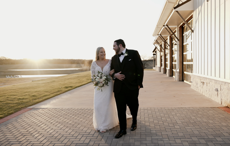 groom embracing bride