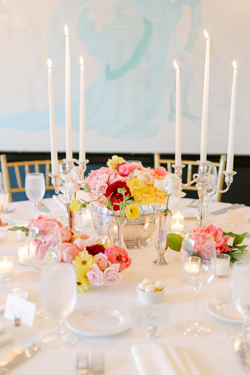 spring wedding flowers on table  with bright yellow and pink