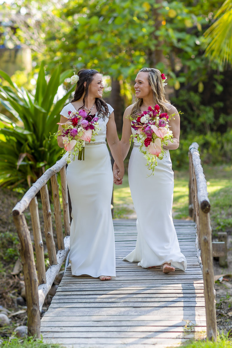 Two brides walking on bride at Sai Nuan