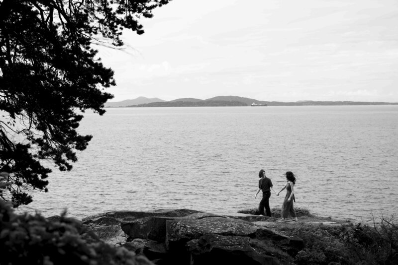 Couple walking along the coast at Larrabee State Park in Washington, beach