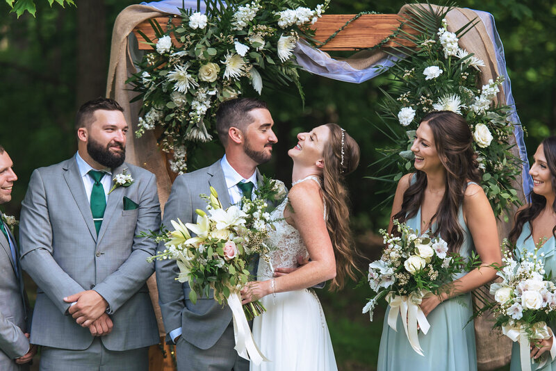 Bride and Groom sharing a hearty laugh during bridal party photos