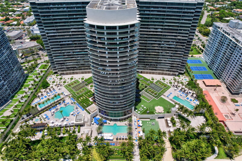 Aerial view of St. Regis Bal Harbour Center Tower with pools and beachfront, home to PH-888 penthouse
