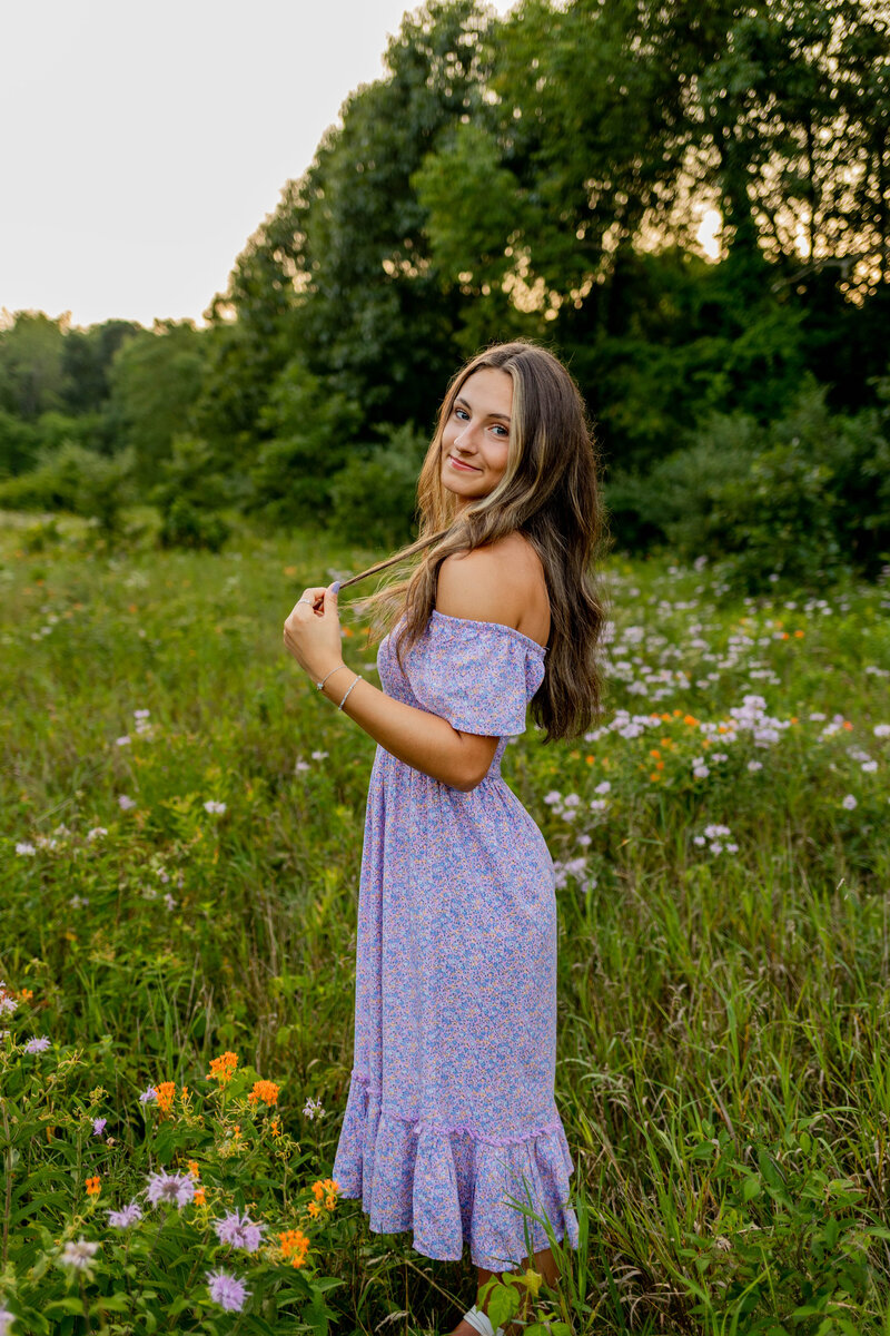 Girl in flower field with dress