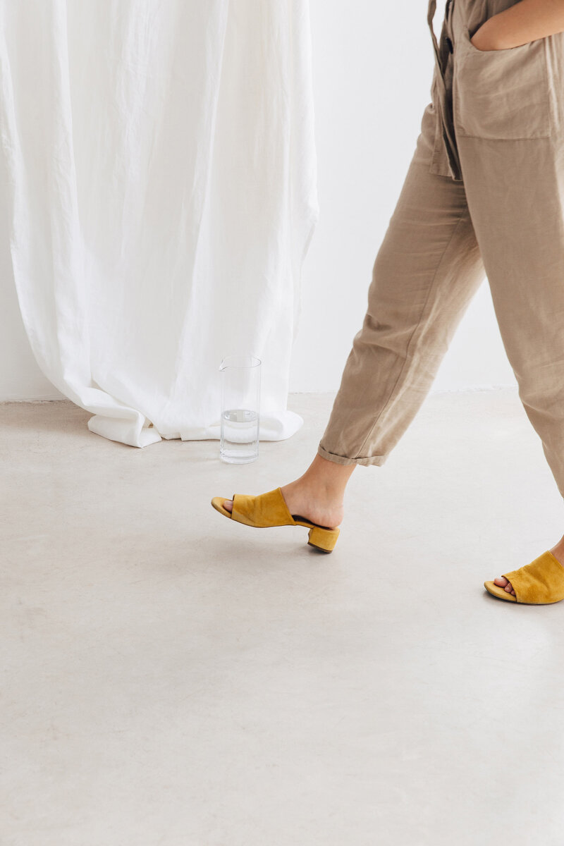 woman walking with yellow shoes