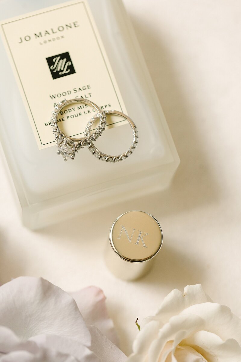 bridal detail photo of rings and perfume