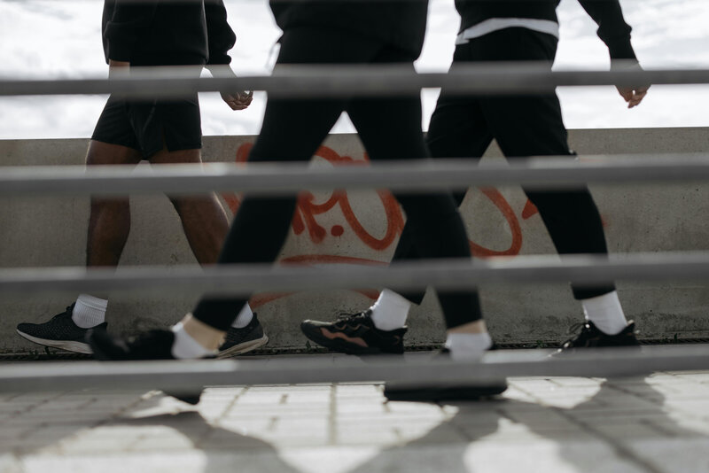 Personal trainers walking on street