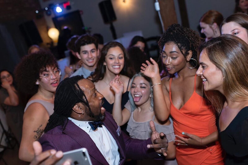 DJ Marz hyping up a crowd of excited party guests