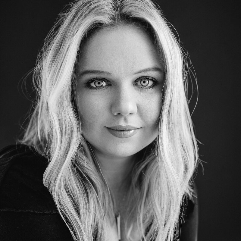 Black and white photo of a woman with blonde hair.