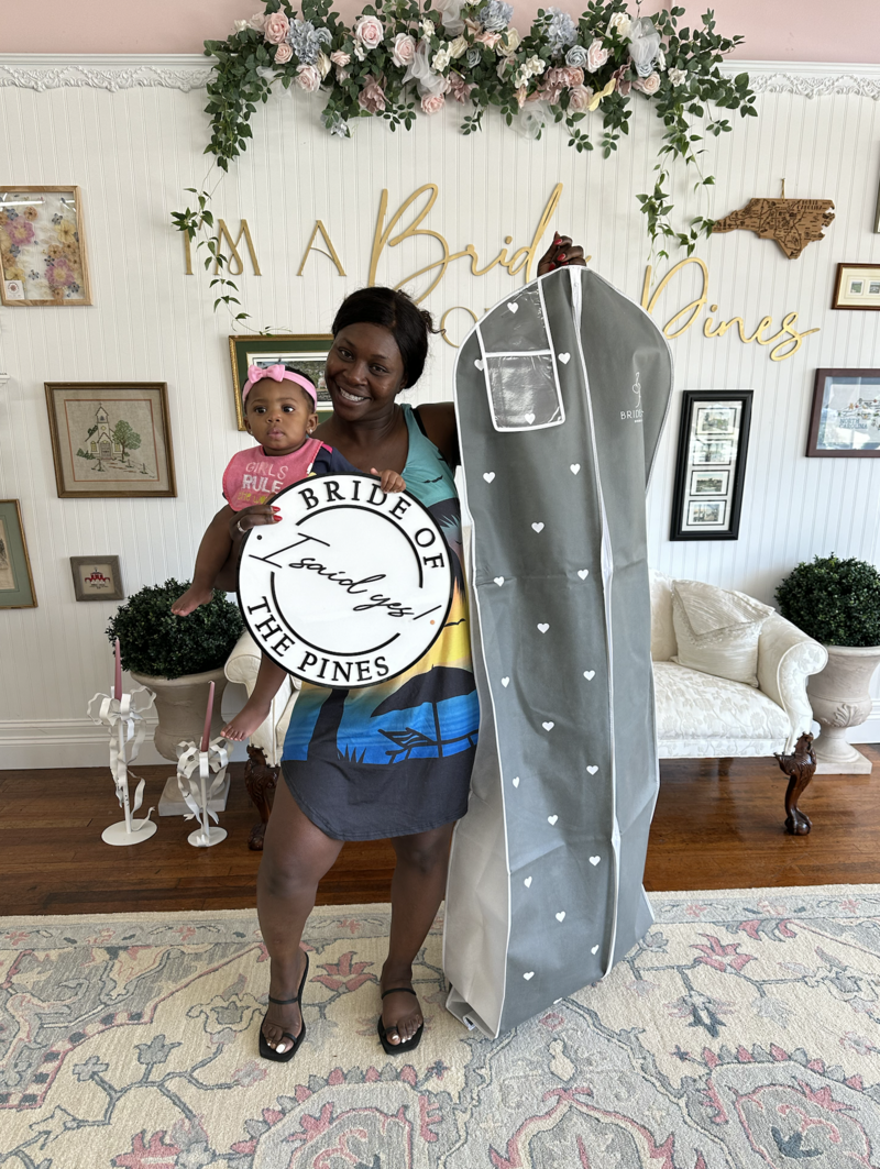 bride taking home her dream wedding dress from bride of the pines in aberdeen nc