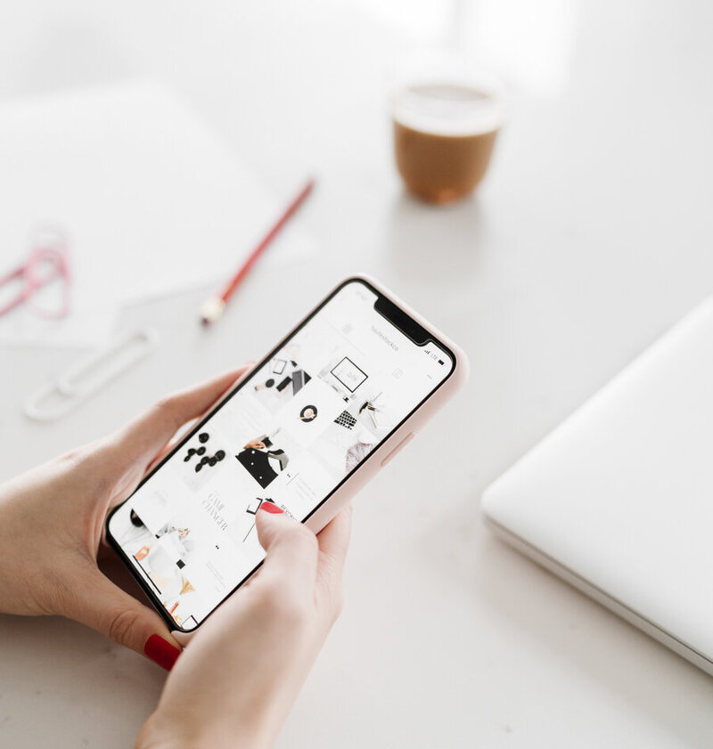 Social media manager checking instagram insights and content ideas