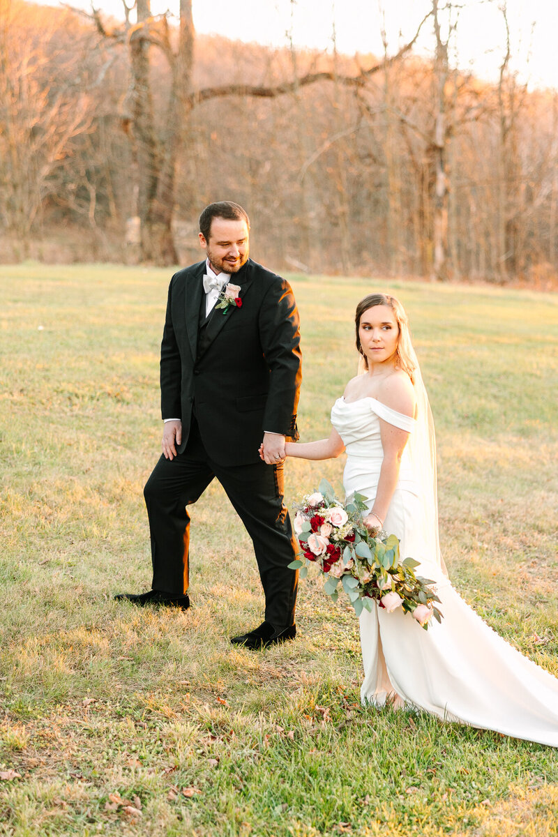 Bride and groom kiss in the aisle as guests celebrate