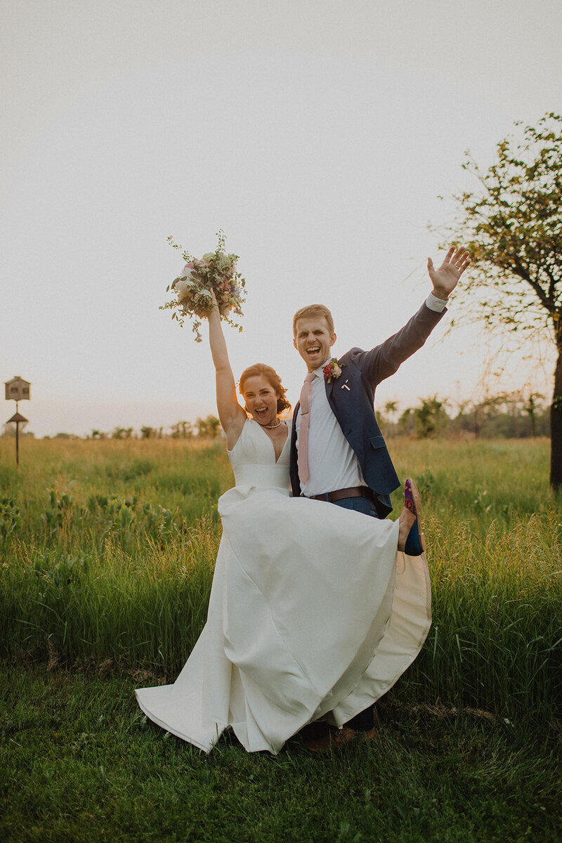 Bride and Groom pose in field at Irvine Nature Center