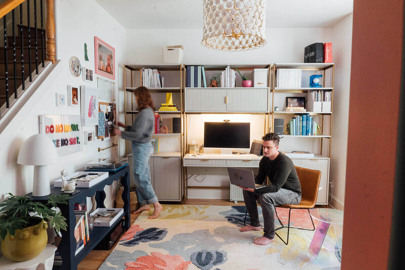 Two people in a colorful home office representing custom home interior design by Winsome Home Interiors.