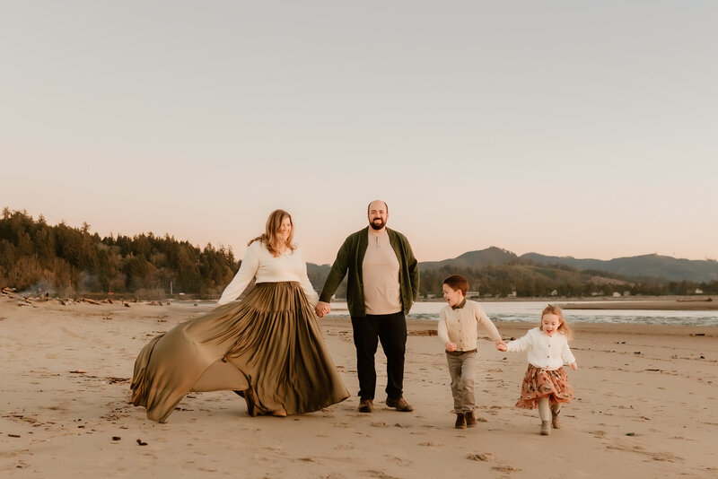 Hope's family running on the beach at sunset.