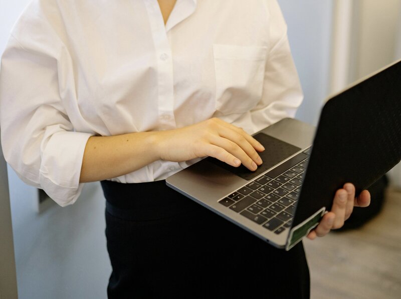 woman holding laptop