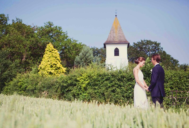 Couple in the field next to the church