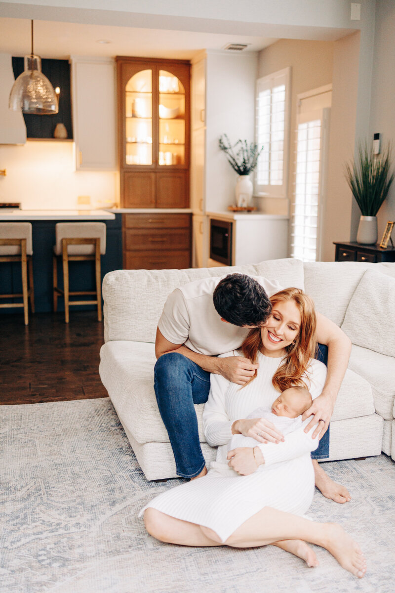 family with their dog and newborn baby taken by a houston newborn photographer