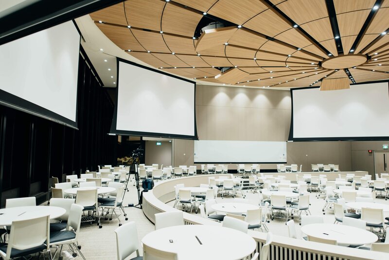 corporate event dinner layout in an auditorium