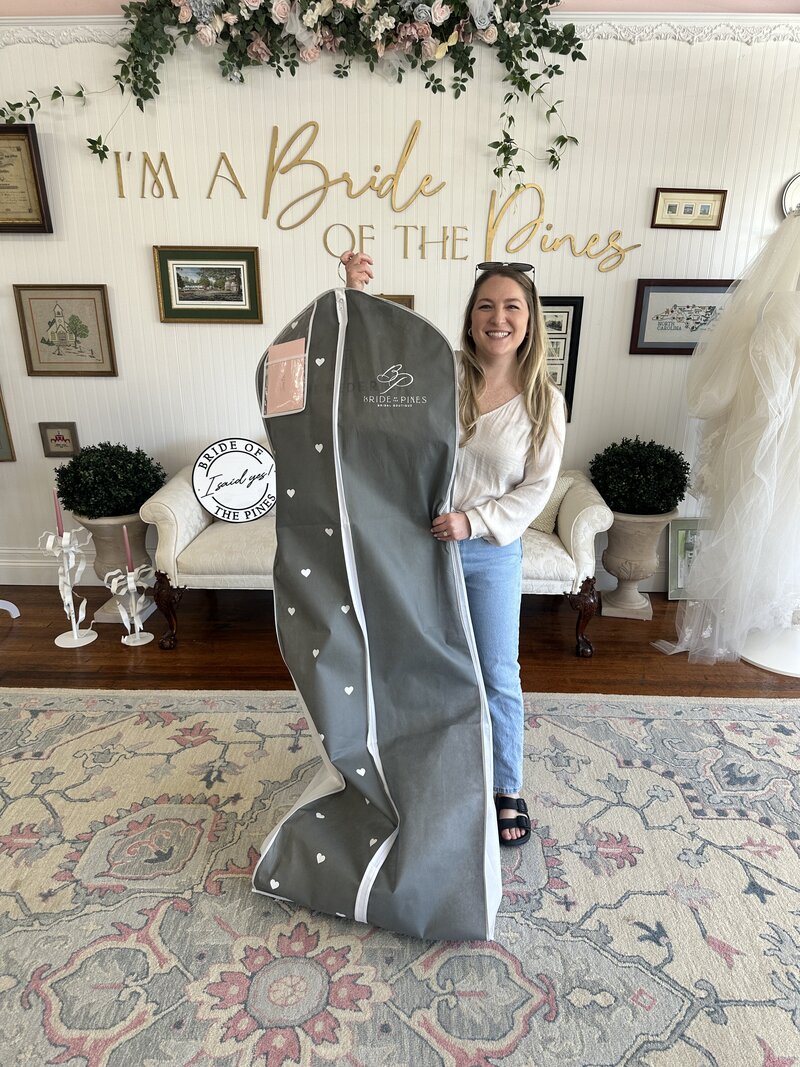 bride with her wedding dress she just bought at aberdeen nc wedding dress shop