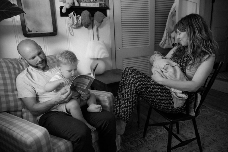 Family of four photographed in their family home shot in black and white in Nashville, TN.