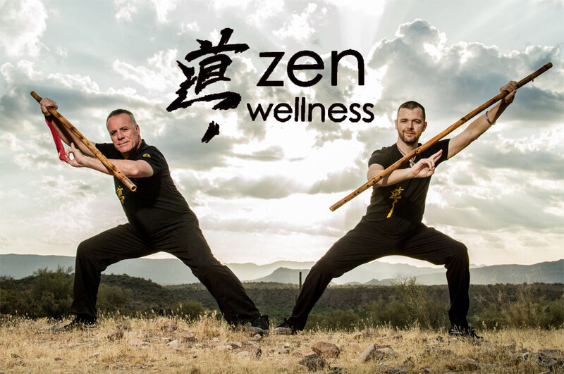 Branding Photo two Zen Wellness instructors with long wooden flutes standing in yoga poses on canyon with clouds and sun behind them