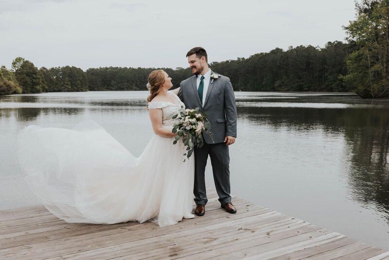 bride and groom on pier