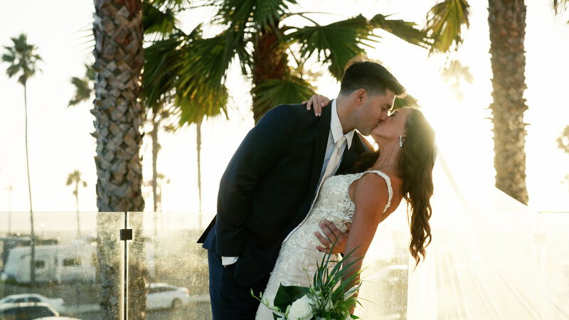 san diego wedding video still bride and groom holding hands at marina