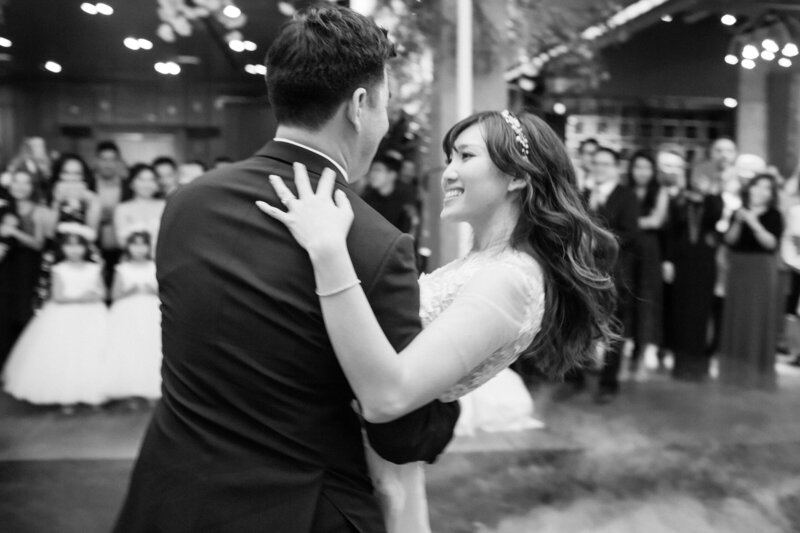 black and white movement image with couple dancing during reception