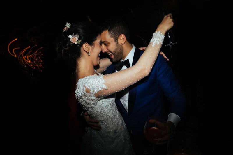 A bride and groom dance the night away at the after party.