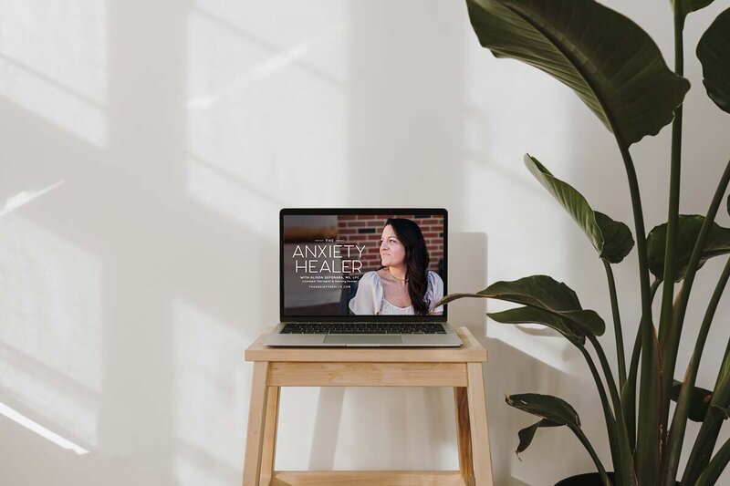 laptop on wooden stool