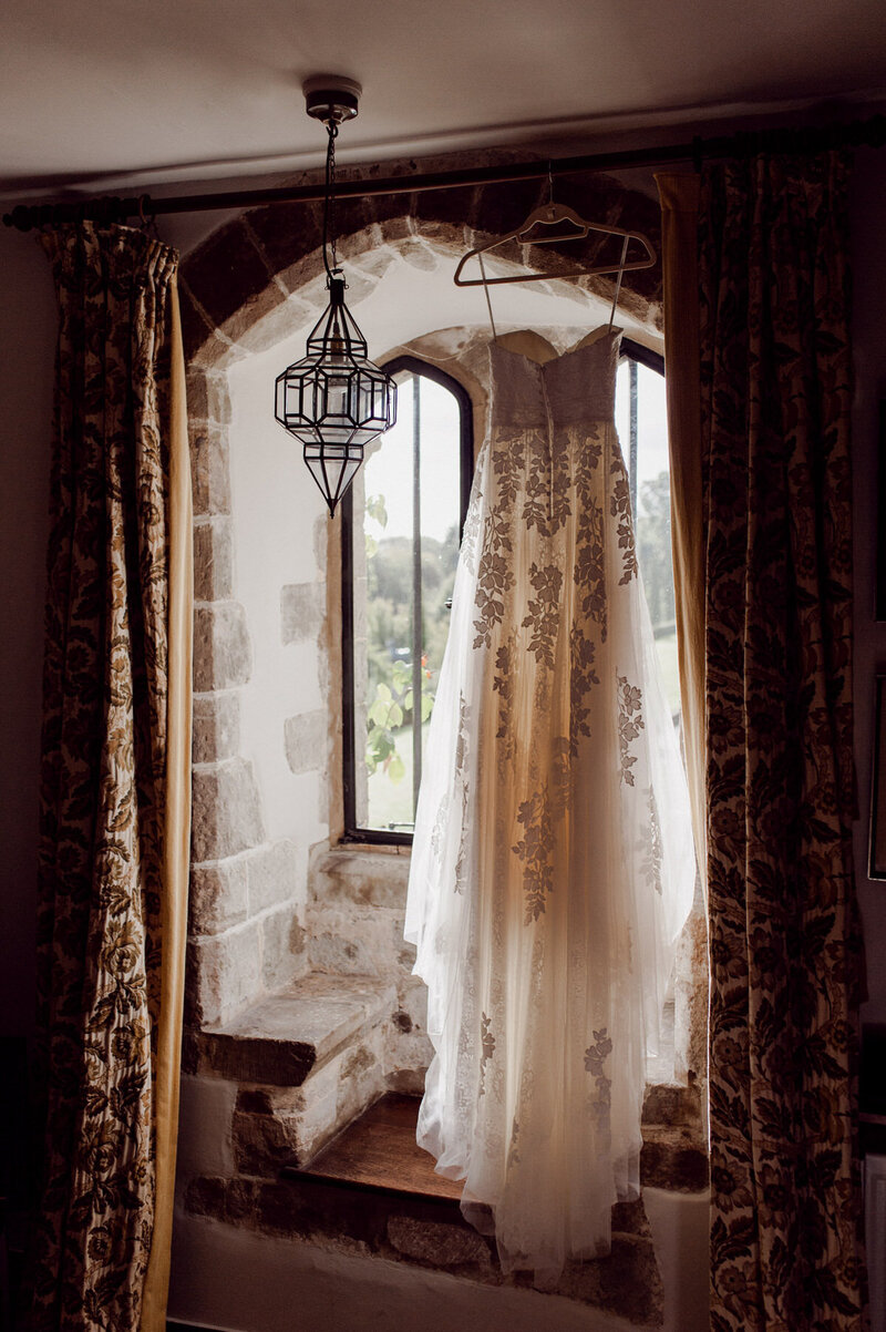 wedding dress within window