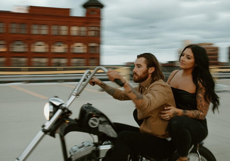 Tattooed couple on motorcycle