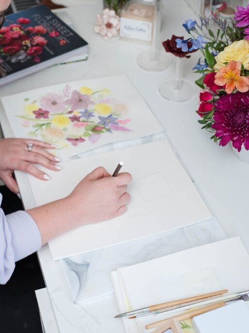 sketching watercolor flowers for a garden inspired sugar flower wedding cake design