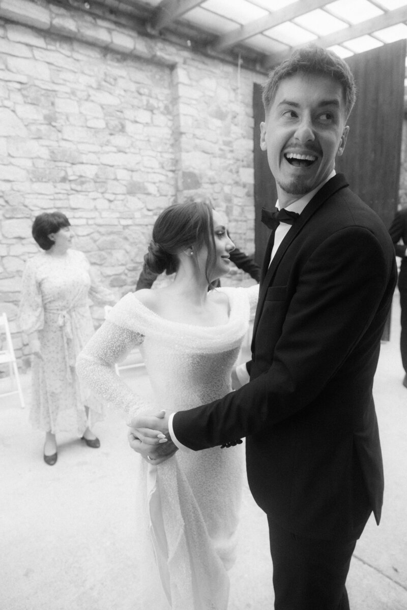 Luxury wedding in Europe – sophisticated bride in a modern wedding gown and groom in a timeless suit.