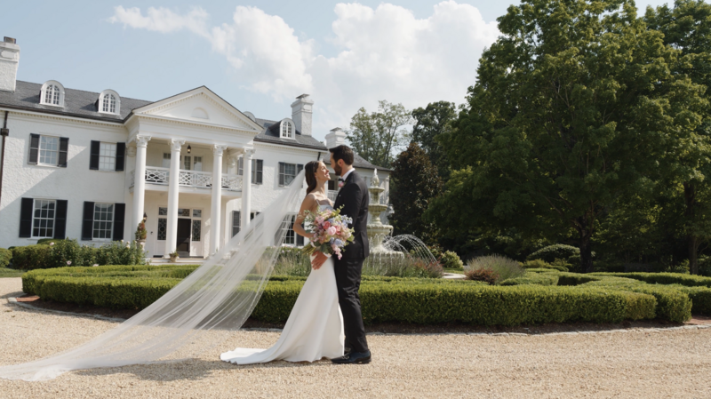 Husband and wife kiss at Keswick Vineyards in Keswick, Virginia