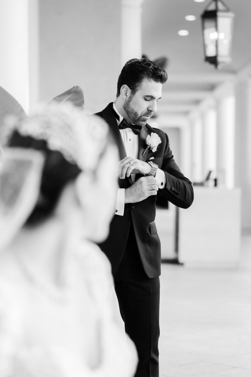 black and white groom portrait at a wedding at the four seasons Orlando by Florida wedding photographer.