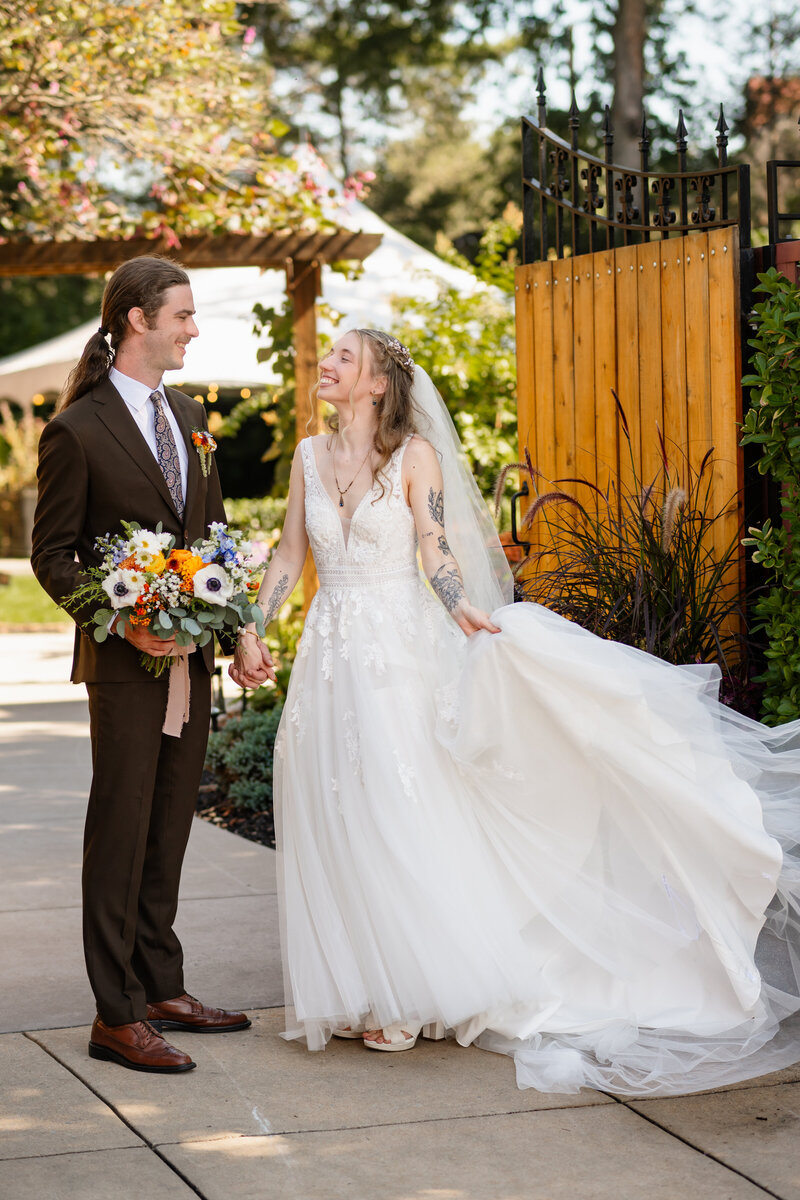 A groom kissing a bride's cheek.