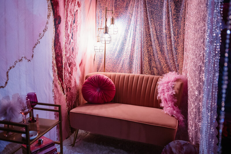 pink studio set with pink wall pink couch and pink pillows