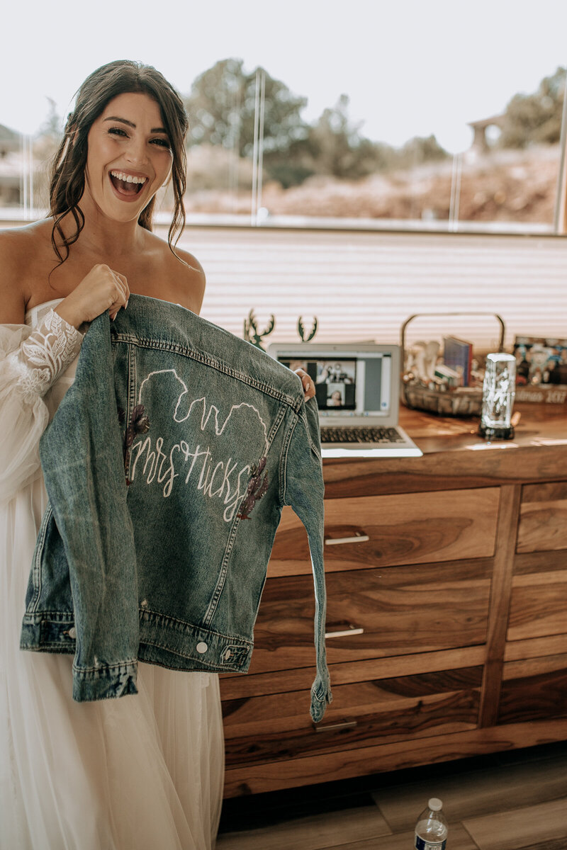 bride gifted a denim jacket to wear on her wedding day