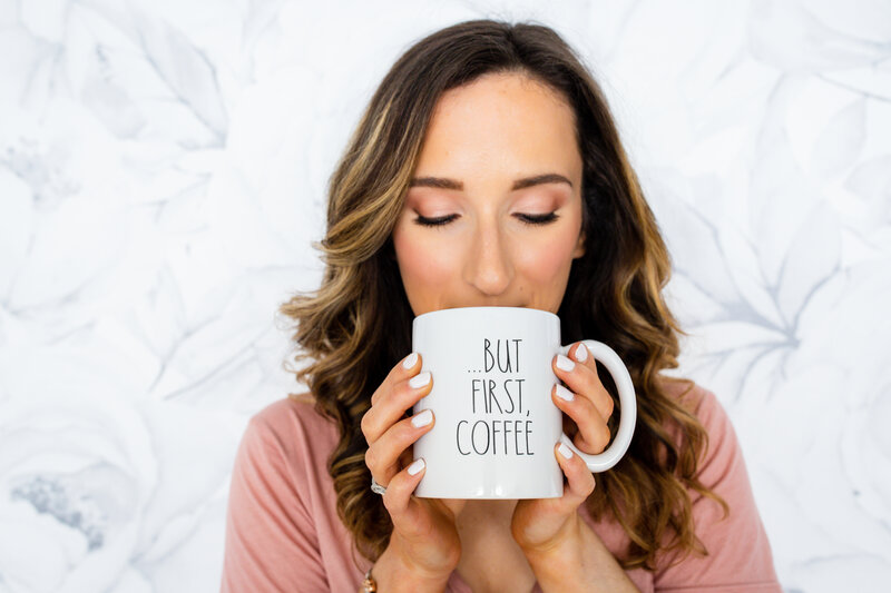 Payton Bendure, social media strategy for small business, up close Payton holding a coffee mug that says but first, coffee