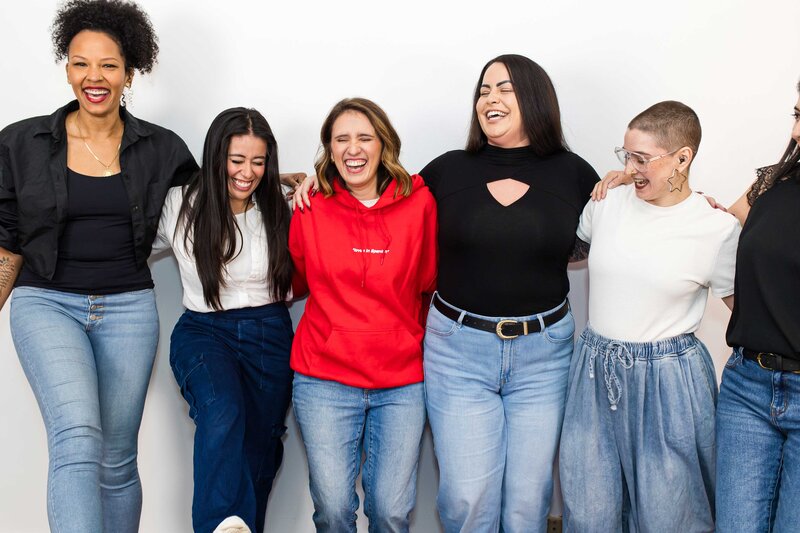 Latina-owned business professionals celebrating successful brand and website design results, showcasing the power and impact of Latina-owned businesses.