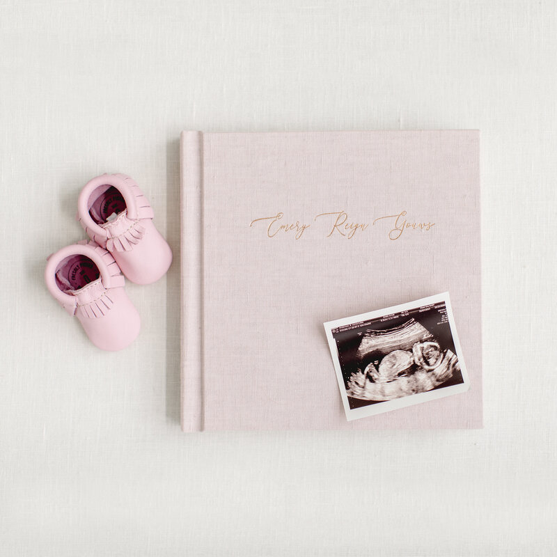 babys keepsakes milestone baby book with newborn photographer