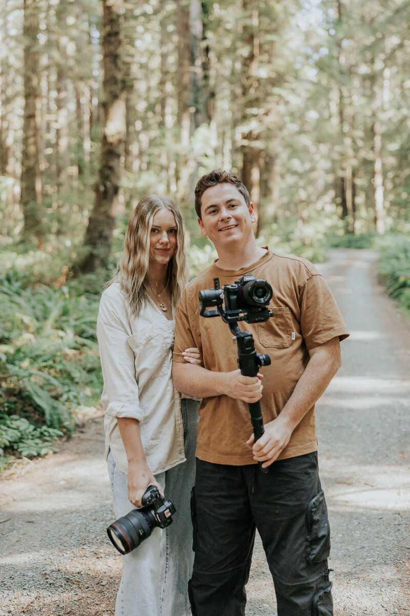 Bre and Clay posing with their cameras