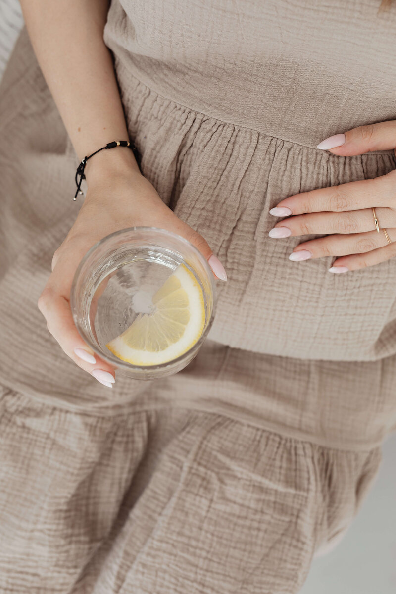 expecting mom holding bump