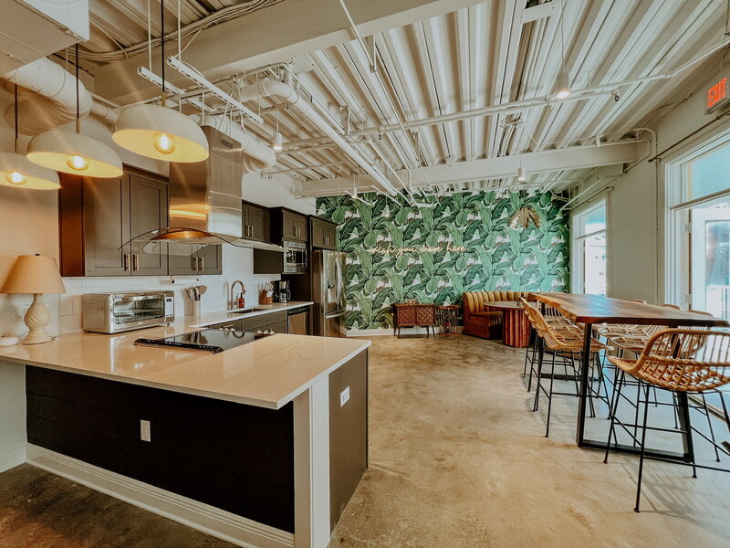 modern kitchen with palm leaf wallpaper