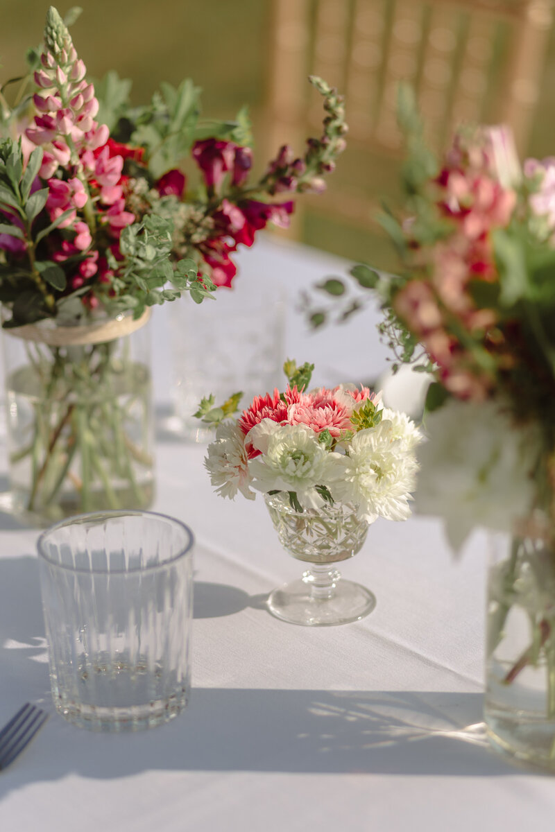 Summer floral arrangements on table at elopement in Carp Ontario